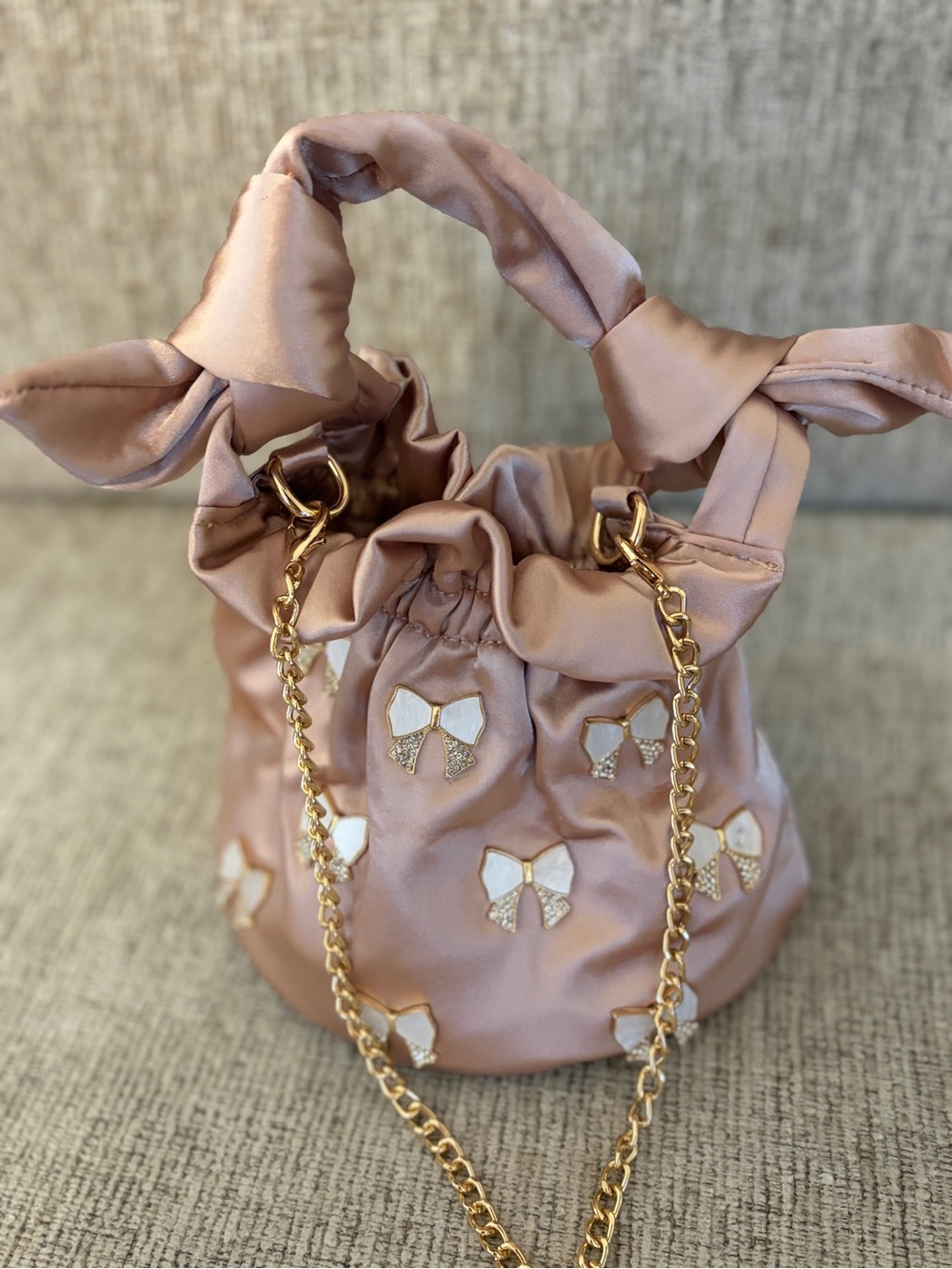 Stylish Pink Satin Bow Drawstring Bag with Gold Chain